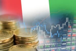 monete italiane con grafici finanziari sullo sfondo